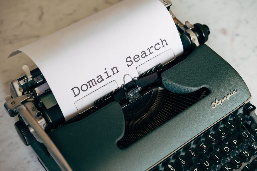 Competitor owns plural version of my domain and redirects it